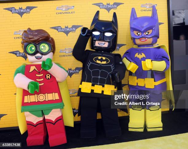 Robin, Batman and Batgirl arrive for the Premiere Of Warner Bros. Pictures' "The LEGO Batman Movie" held at Regency Village Theatre on February 4,...