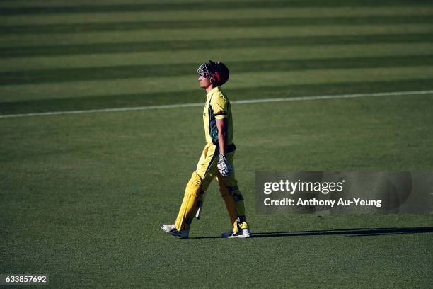 Marcus Stoinis of Australia walks off the field after being dismissed by Mitchell Santner of New Zealand during game three of the One Day...