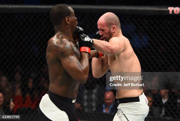 Volkan Oezdemir of Switzerland exchanges punches with Ovince Saint Preux in their light heavyweight bout during the UFC Fight Night event at the...