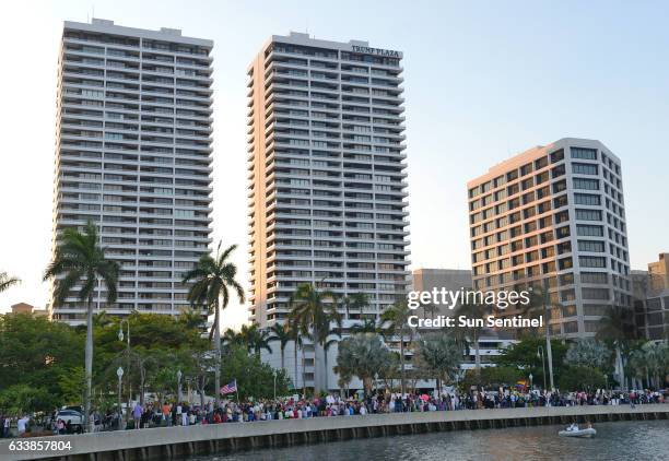 Large group protesting President Trump organized in front of Trump Plaza in West Palm Beach, Fla., to begin their march toward Mar-a-Lago, Trump's...