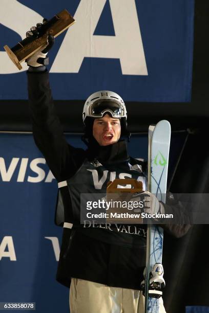 Brodie Summers of Australia celebrates on the medals podium after finishing third in the Men's Dual Moguls during the FIS Freestyle World Cup at Deer...