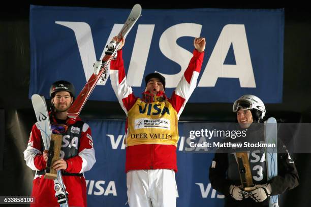 Marc-Antoine Gagnon of Canada, Mikael Kingsbury of Canada and Brodie Summers of Australia celebrate on the medals podium after the Men's Dual Moguls...