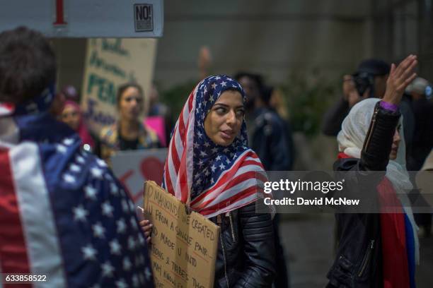 Demonstrators march in support of a ruling by a federal judge in Seattle that grants a nationwide temporary restraining order against the...