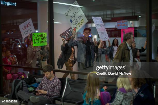 Demonstrators march in support of a ruling by a federal judge in Seattle that grants a nationwide temporary restraining order against the...