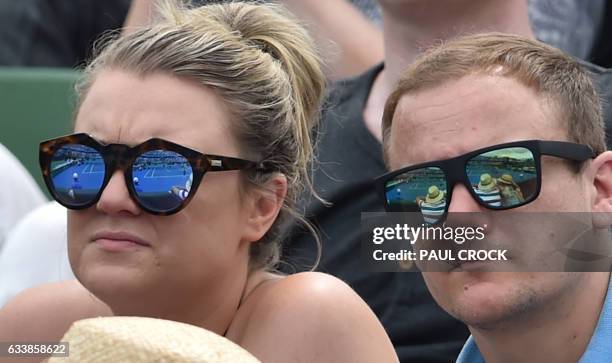The court is reflected in fans' sunglasses as they watch Jordan Thompson of Australia beat Jan Satral of the Czech Republic during the Davis Cup...