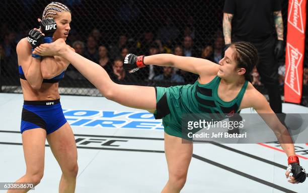 Alexa Grasso of Mexico kicks Felice Herrig in their women's strawweight bout during the UFC Fight Night event at the Toyota Center on February 4,...