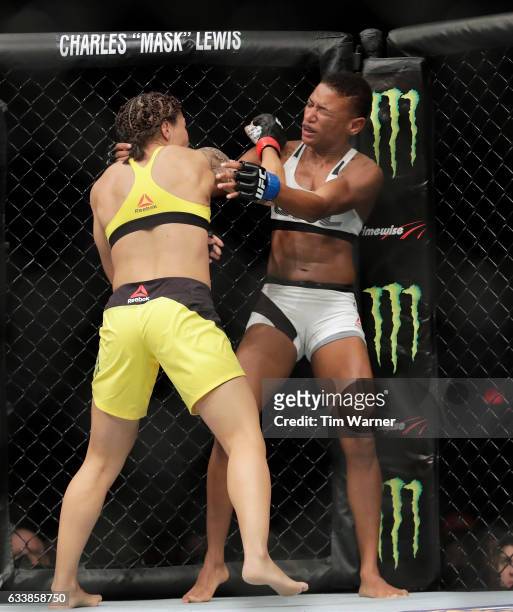 Jessica Andrade of Brazil hits Angela Hill with a right hand during their women's strawweight bout at UFC Fight Night at the Toyota Center on...