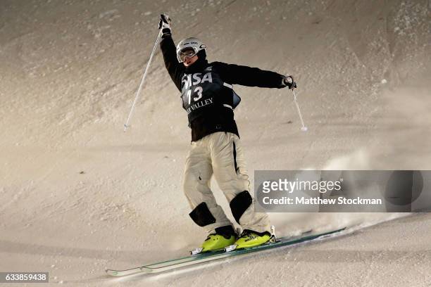 Brodie Summers of Australia celebrates after crossing the finish line to place third in the Men's Dual Moguls during the FIS Freestyle World Cup at...