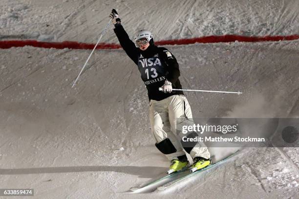 Brodie Summers of Australia celebrates after crossing the finish line to place third in the Men's Dual Moguls during the FIS Freestyle World Cup at...