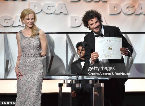 Actors Nicole Kidman and Sunny Pawar present the Feature Film Nomination Plaque for Lion to director Garth Davis onstage during the 69th Annual...