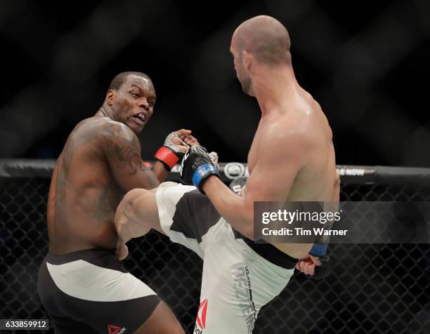 Volkan Oezdemir of Switzerland kicks Ovince Saint Preux in the third round of their light heavyweight bout during the UFC Fight Night event at the...