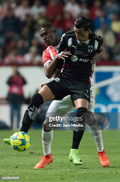 Rogelio Funes Mori of Monterrey fights for the ball with Brayan Beckeles of Necaxa during the 5th round match between Necaxa and Monterrey as part of...