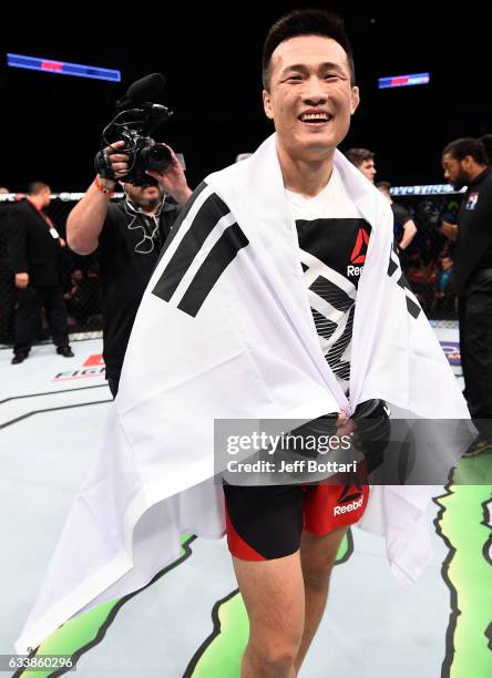 Chan Sung Jung of South Korea celebrates his victory over Dennis Bermudez in their featherweight bout during the UFC Fight Night event at the Toyota...