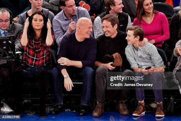 Emma Heming Willis, Bruce Willis, David Duchovny and Kyd Miller Duchovny attend Cleveland Cavaliers Vs. New York Knicks game at Madison Square Garden...