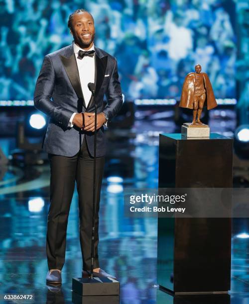 Larry Fitzgerald accepts the Walter Payton NFL Man of the Year presented by Nationwide at Wortham Theater Center on February 4, 2017 in Houston,...