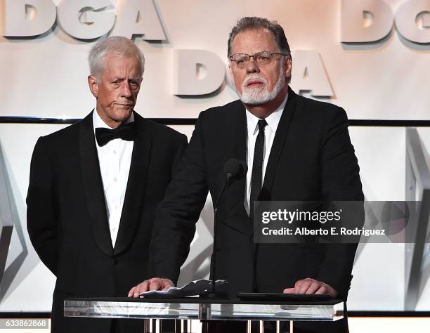 Secretary-Treasurer Michael Apted and director Taylor Hackford speak onstage during the 69th Annual Directors Guild of America Awards at The Beverly...