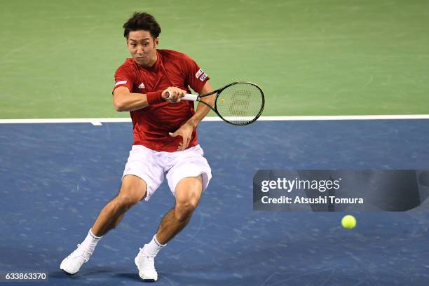 Yasutaka Uchiyama of Japan plays a forehand in his match against Pierre-Hugues Herbert of France during the Davis Cup by BNP Paribas first round...