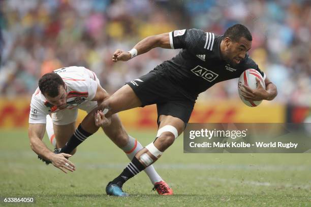 Tom Bowen of England tackles Sione Molia of New Zealand during the semi final match between England and New Zealand in the 2017 HSBC Sydney Sevens at...