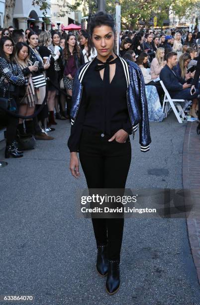 Actress Janina Gavankar attends Rebecca Minkkoff's "See Now, Buy Now" fashion show at The Grove on February 4, 2017 in Los Angeles, California.