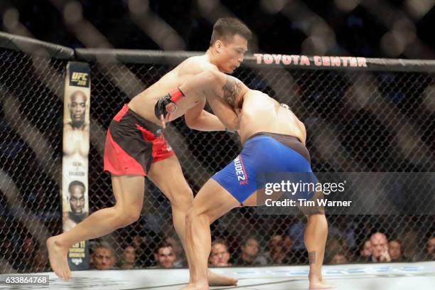 Chan Sung Jung of South Korea fights Dennis Bermudez in the first round of their featherweight bout during the UFC Fight Night event at the Toyota...