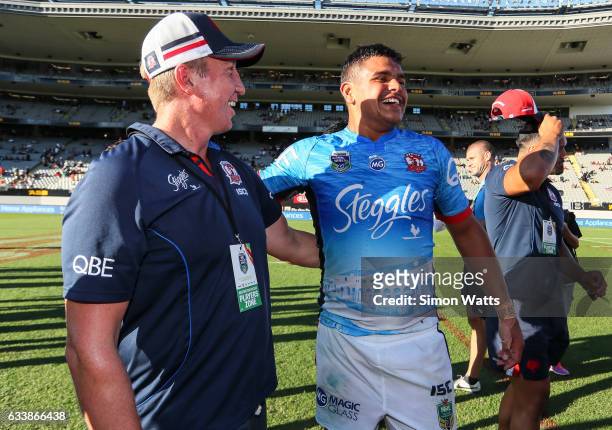 Latrell Mitchell and coach Trent Robinson of the Roosters celebrate winning the 2017 Auckland Nines final between The Sydney Roosters and Penrith...