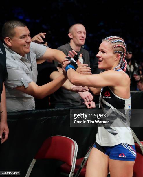 Felice Herrig celebrates with a fan after defeating Alexa Grasso on February 4, 2017 in Houston, Texas.