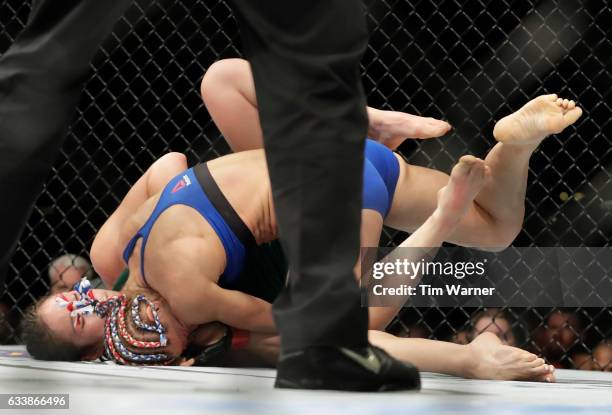 Felice Herrig takes Alexa Grasso of Mexico down in the second round on February 4, 2017 in Houston, Texas.