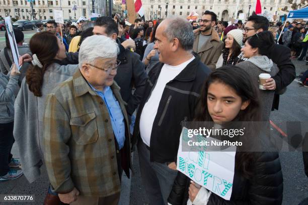 Former California congressman Mike Honda talks with protesters of President Donald Trump's Muslim travel ban at San Francisco City Hall during a...