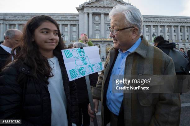 Former California congressman Mike Honda talks with protesters of President Donald Trump's Muslim travel ban at San Francisco City Hall during a...
