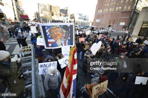 Protestors march on Market St. In Philadelphia, PA, on February 4th, 2017. In protest of the Donald Trump Presidency an estimated 5.000 participate...