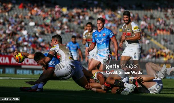 Joseph Manu of the Roosters looks to score a try during the 2017 Auckland Nines final between The Sydney Roosters and Penrith Panthers at Eden Park...