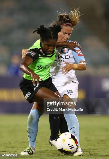 Jasmyne Spencer of Canberra is tackled by Lauren Barnes of Melbourne City during the W-League Semi Final match between Canberra United and Melbourne...