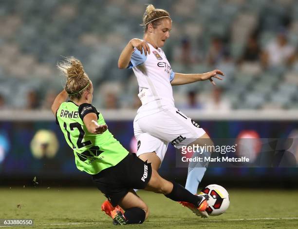 Marianna Tabain of Melbourne City is tackled by Hannah Brewer of Canberra during the W-League Semi Final match between Canberra United and Melbourne...