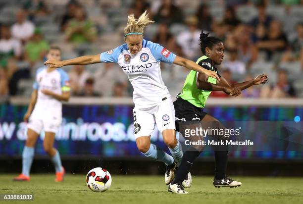 Aivi Luik of Melbourne City and Jasmyne Spencer of Canberra compete for the ball during the W-League Semi Final match between Canberra United and...