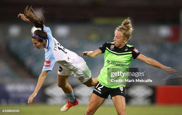 Erika Tymrak of Melbourne City and Hannah Brewer of Canberra compete during the W-League Semi Final match between Canberra United and Melbourne City...