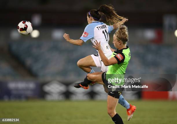 Erika Tymrak of Melbourne City and Hannah Brewer of Canberra compete for the ball during the W-League Semi Final match between Canberra United and...
