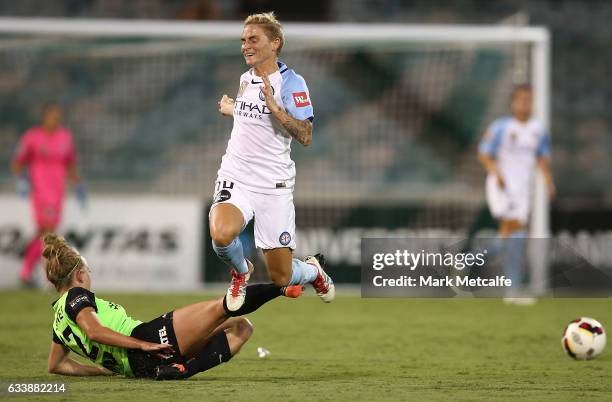 Jessica Fishlock of Melbourne City is tackled by Hannah Brewer of Canberra during the W-League Semi Final match between Canberra United and Melbourne...