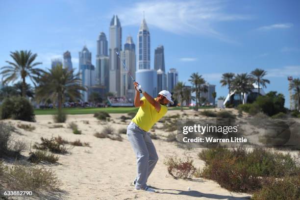 Sergio Garcia of Spain hits his second shot on the 8th hole during the final round of the Omega Dubai Desert Classic at Emirates Golf Club on...