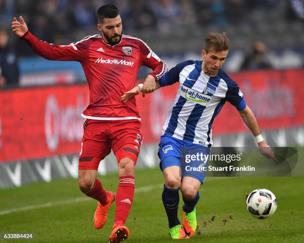 Peter Pekarik of Berlin is challenged by Anthony Jung of Ingolstadt during the Bundesliga match between Hertha BSC and FC Ingolstadt 04 at...