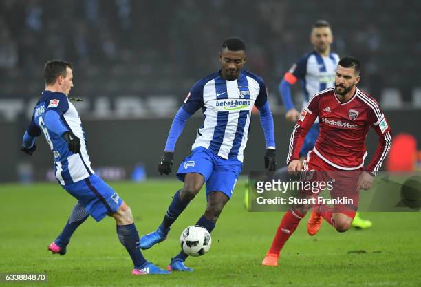 Salomon Kalou of Berlin is challenged by Anthony Jung of Ingolstadt during the Bundesliga match between Hertha BSC and FC Ingolstadt 04 at...