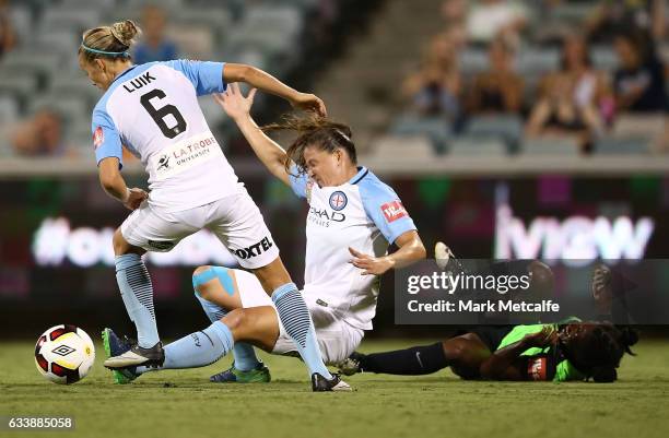 Jasmyne Spencer of Canberra is tackled by Aivi Luik of Melbourne City during the W-League Semi Final match between Canberra United and Melbourne City...