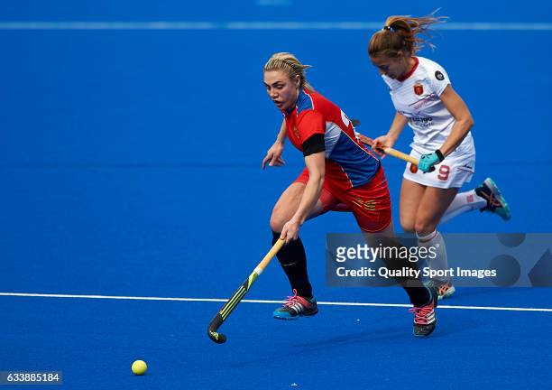 Maria Lopez of Spain competes for the ball with Bogdana Sadovaia of Russia during the match between Spain and Russia during day one of the Hockey...
