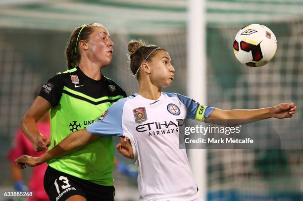 Steph Catley of Melbourne City and Celeste Boureille of Canberra compete for the ball during the W-League Semi Final match between Canberra United...