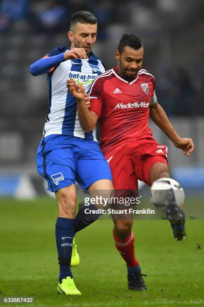 Vedad Ibisevic of Berlin is challenged by Marvin Matip of Ingolstadt during the Bundesliga match between Hertha BSC and FC Ingolstadt 04 at...