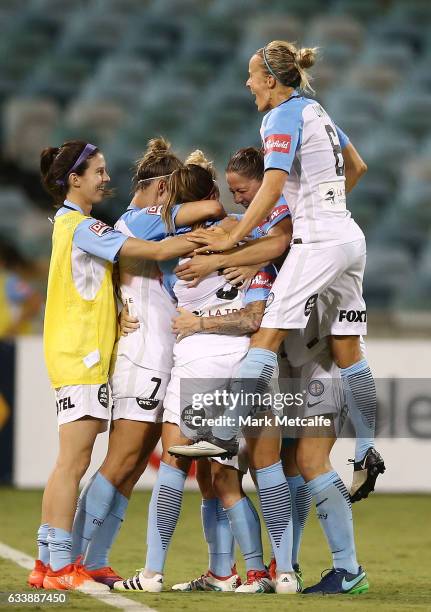 Jessica Fishlock of Melbourne City celebrates scoring a goal with team mates during the W-League Semi Final match between Canberra United and...