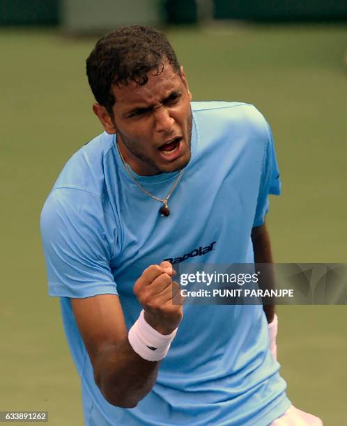 India's Ramkumar Ramanathan reacts after winning a game during a Davis Cup singles tennis match against New Zealand's Finn Tearney at the Balewadi...