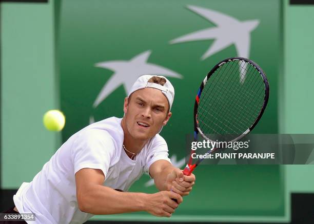 New Zealand's Finn Tearney returns a shot during a Davis Cup singles tennis match against India's Ramkumar Ramanathan at the Balewadi Sports Complex...