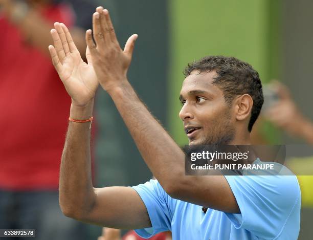 India's Ramkumar Ramanathan gestures towards the crowd after winning the Davis Cup singles tennis match against New Zealand's Finn Tearney at the...