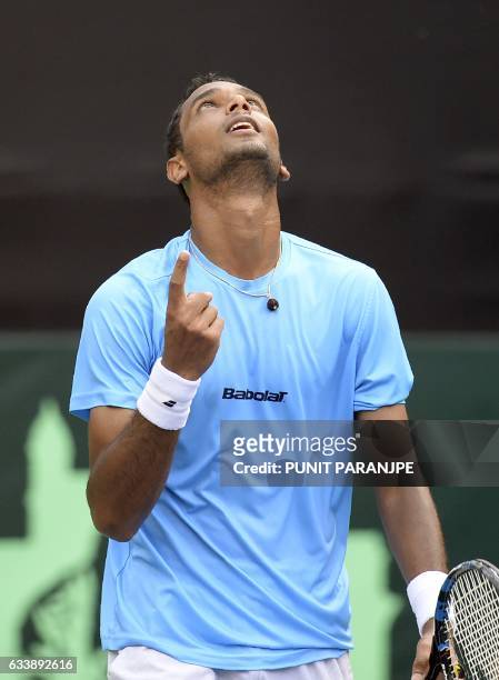 India's Ramkumar Ramanathan reacts after winning the Davis Cup singles tennis match against New Zealand's Finn Tearney at the Balewadi Sports Complex...