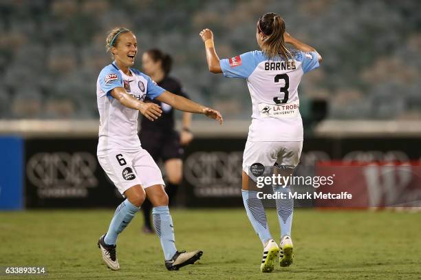 Aivi Luik and Lauren Barnes of Melbourne City celebrate victory at the end of the W-League Semi Final match between Canberra United and Melbourne...